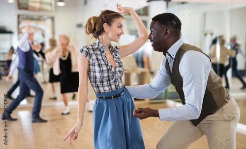 Pair dancing lindy hop during rehearsal