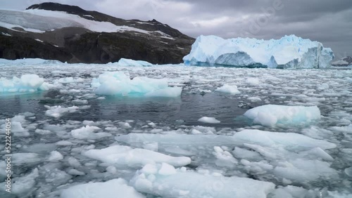 Wallpaper Mural Melting Iceberg with ice floe in foreground, floating in the sea Torontodigital.ca