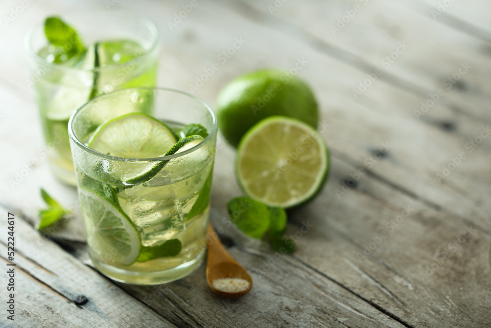 Refreshing homemade Mojito cocktail with lime Refreshing homemade Mojito cocktail with lime