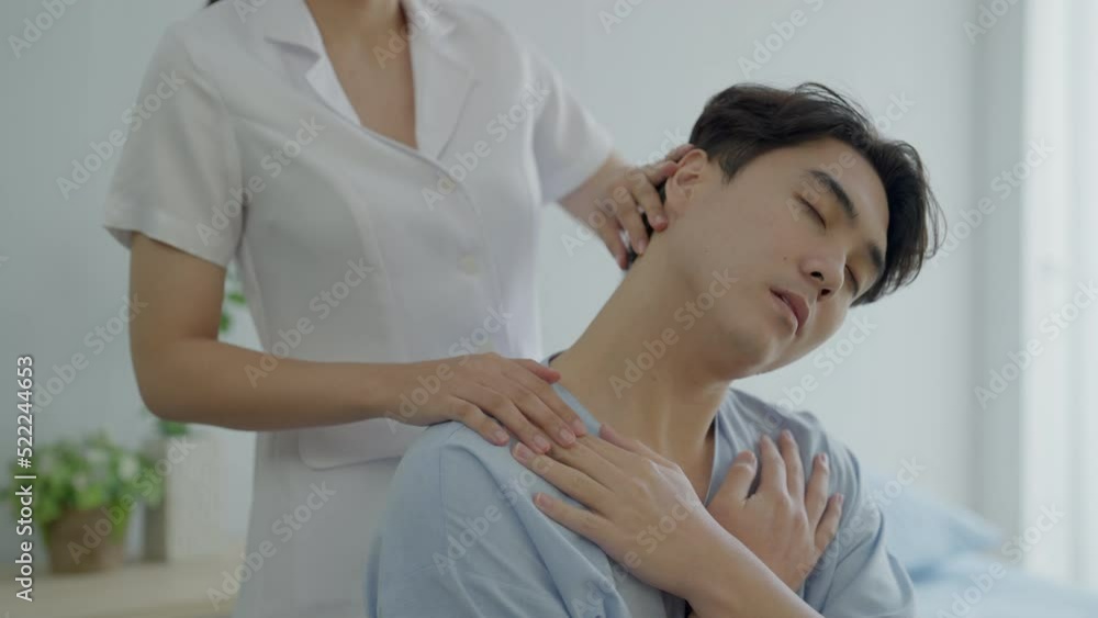 Nurses helping to do physical therapy treatment on body of male patients at hospital. Male patient doing physical therapy treatment at Hospital. Nurses helping to do physical therapy treatment on body of male patients at hospital. Male patient doing physical therapy treatment at Hospital.