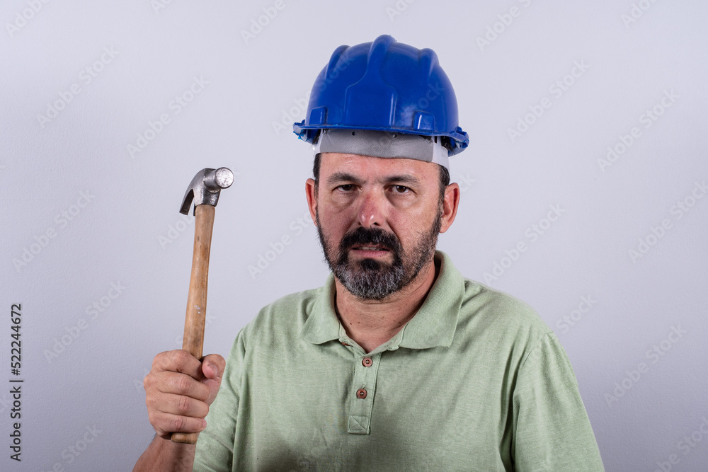 Portrait of happy mature architect in helmet standing male industrial inspector, 60s wearing shirt posing in studio. Portrait of happy mature architect in helmet standing male industrial inspector, 60s wearing shirt posing in studio.