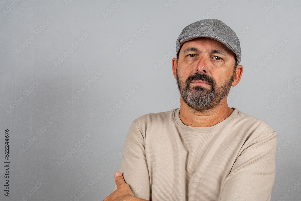 Portrait of charming mature man feel true content emotions wearing beige shirt isolated Portrait of charming mature man feel true content emotions wearing beige shirt isolated