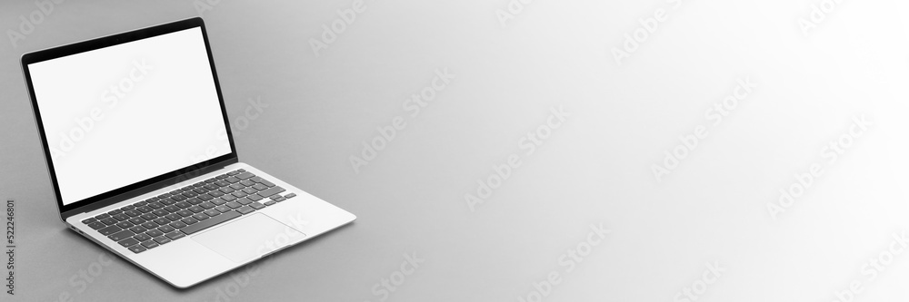 Fototapeta premium modern laptop computer on the tabl on the blackboard background