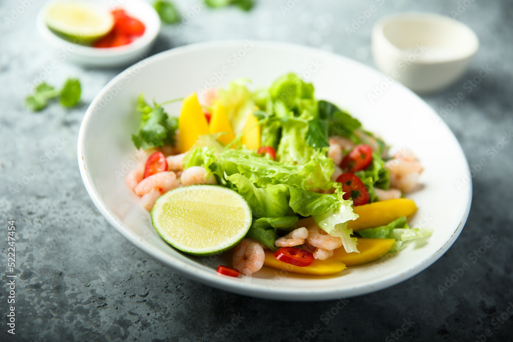 Fresh green salad with shrimps and mango Fresh green salad with shrimps and mango