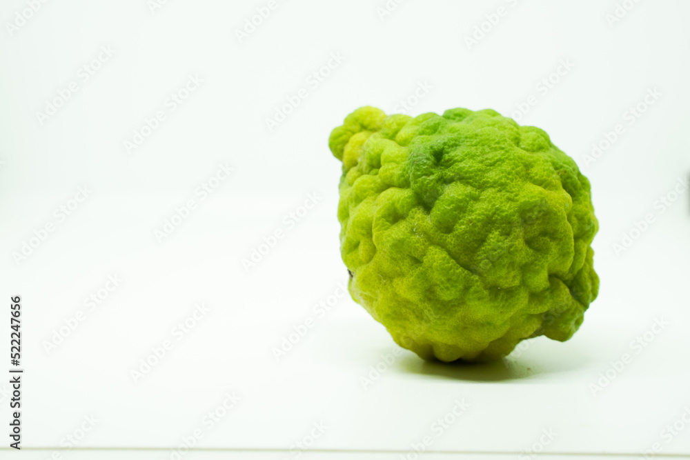 Bergamot fruit with stem and leaf isolated on white background. Clipping path. Bergamot fruit with stem and leaf isolated on white background. Clipping path.