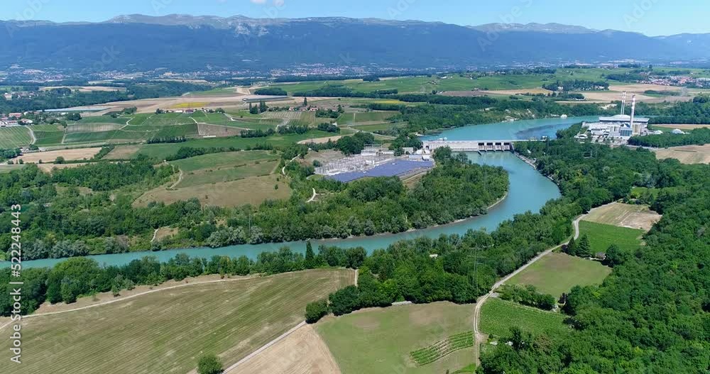 Aerial shot of solar and hydraulic station along a river Aerial shot of solar and hydraulic station along a river