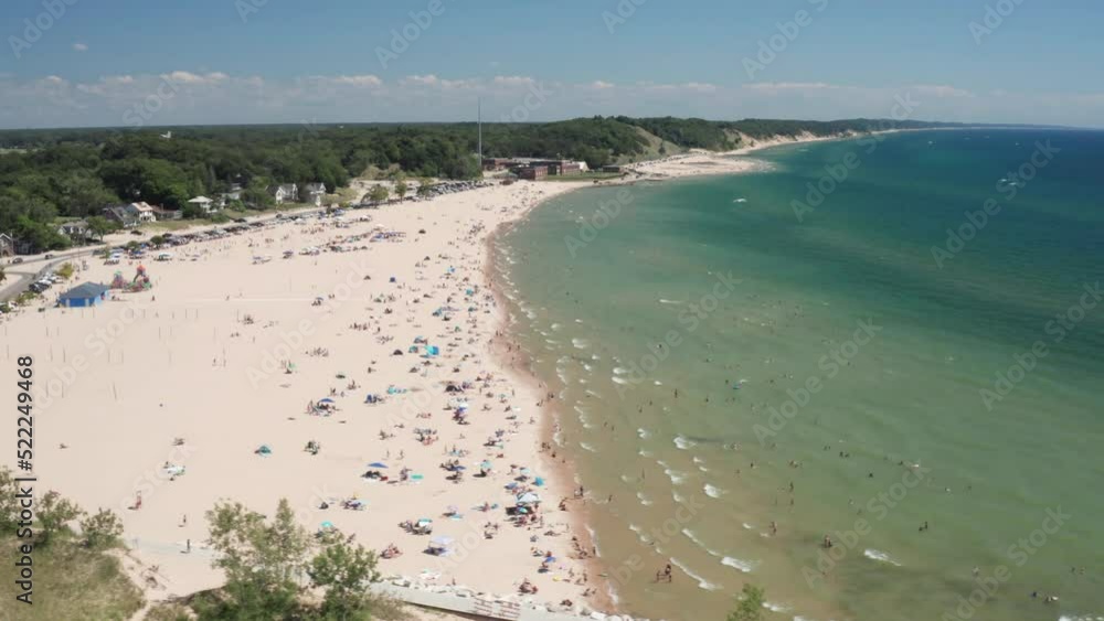 Lake Michigan beach in Muskegon, Michigan with drone video moving sideways. Lake Michigan beach in Muskegon, Michigan with drone video moving sideways.