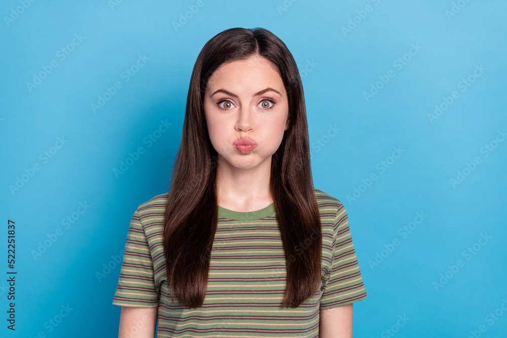 Fototapeta premium Photo of cute millennial brunette lady hold air wear green t-shirt isolated on blue color background