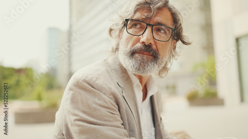 Fotografia Clouse up, mature businessman with beard in eyeglasses wearing gray pondering ja