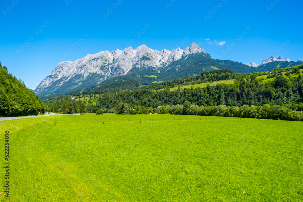 Panorama of beautiful countryside with mountain background in area of Dolomites, Italy