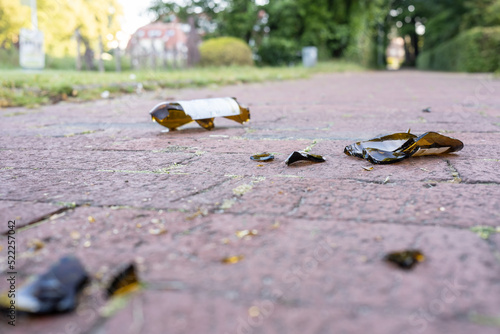 Broken glass bottles on the road after a student booze