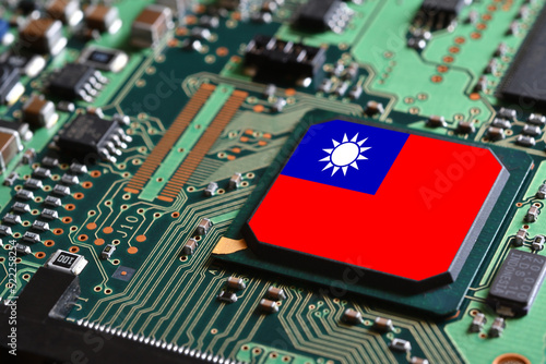 Flag of the Republic of China or Taiwan on semiconductor chip or microchip on a motherboard. Taiwan manufacturing chip industry battle between  in US - China.