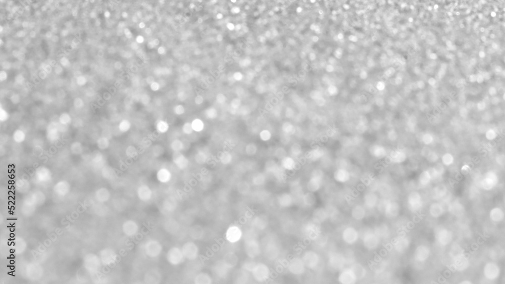 White and grey bokeh glitter background.  New Year, Christmas and all celebrations backgrounds concepts. 