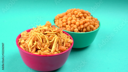 Indian Snacks, Traditional Indian deep fried salty dish called chivda or mixture or farsan made of gram flour and mixed with dry fruits and roasted nuts with salt, pepper, pulses, spice and green peas