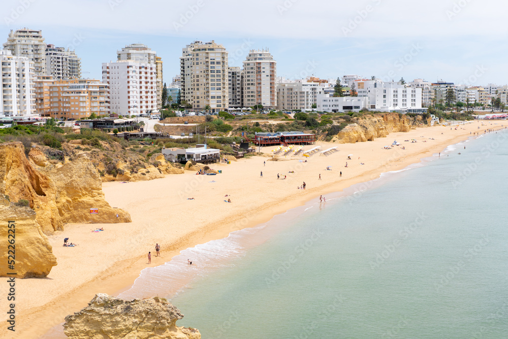 Armacao de Pera Algarve Portugal. Beautiful view on Atlantic ocean at day time and city