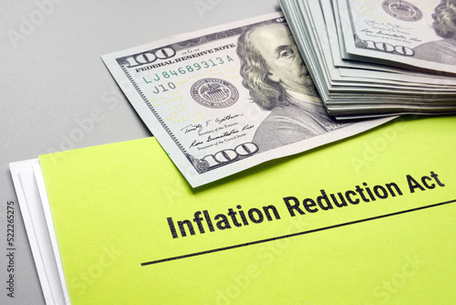 The Inflation Reduction Act of 2022 and cash on it. photo