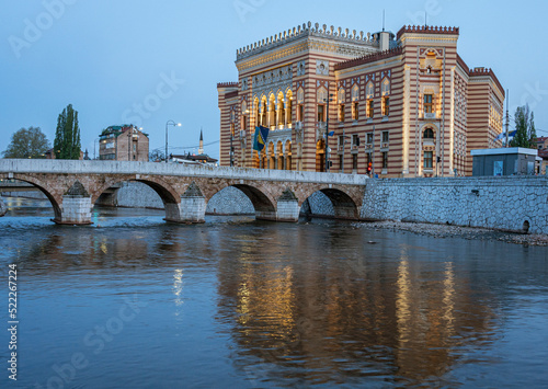 Sarajevo, Bosnia - May 2, 2022 - Library building was the City Hall before The War, and the Latin Bridge.