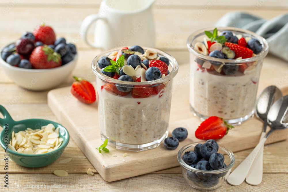 Overnight oats with fresh berries in glass jar, healthy breakfast Overnight oats with fresh berries in glass jar, healthy breakfast