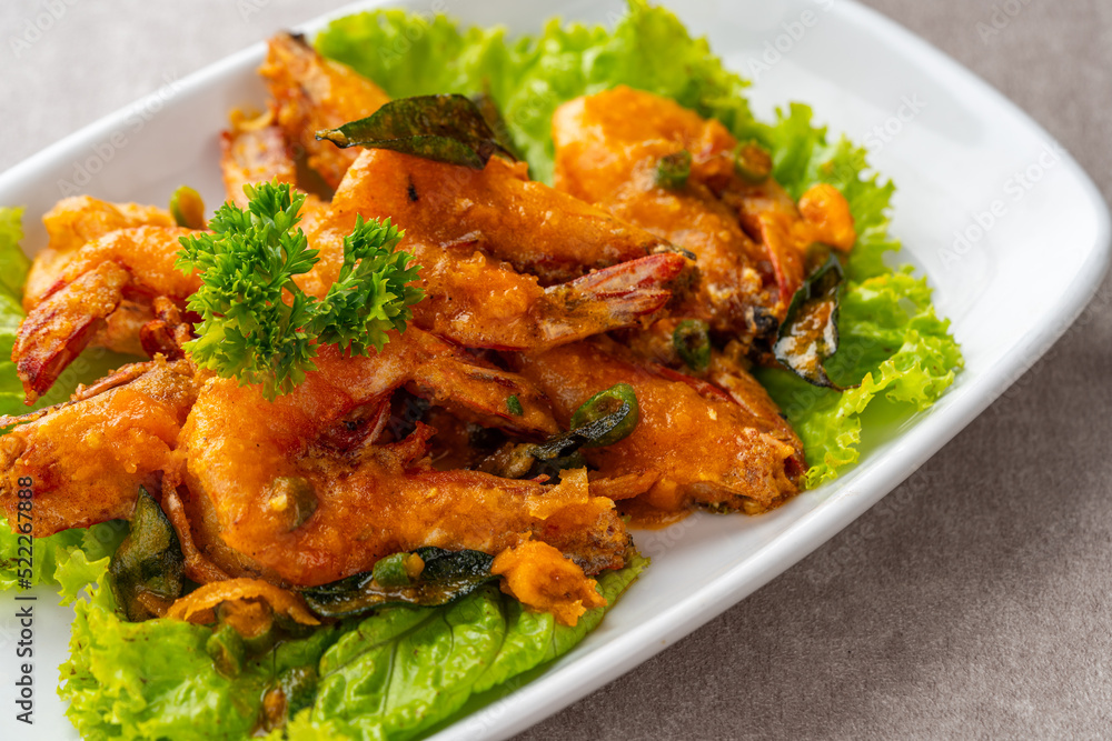 udang saus telur asin or Salted egg fried shrimp with curry leaves udang saus telur asin or Salted egg fried shrimp with curry leaves