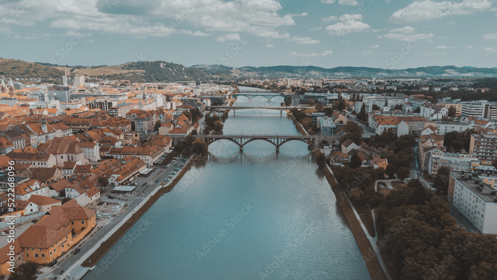 Maribor, Slovenia Drava river on a sunny day. Bright sunny day, Travel in Europe. An aerial view drone photo.
