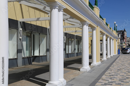 Slika na platnu A colonnaded walkway beside an historic building in Douglas, Isle of Man, Britain