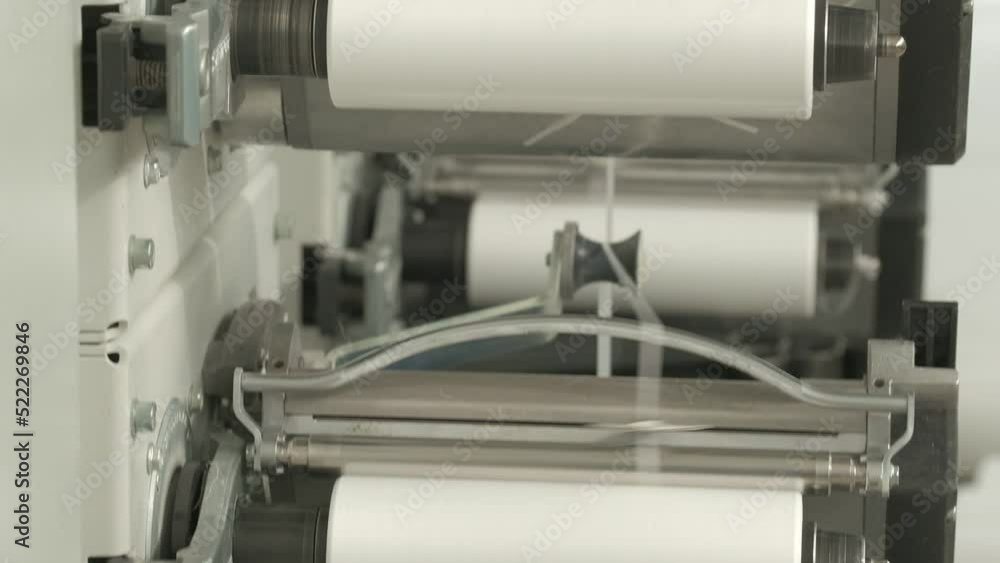 Closeup of polymer thread winding machine in action Closeup of polymer thread winding machine in action
