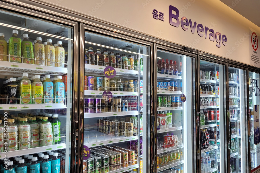 PENANG, MALAYSIA - 9 AUG 2022: Huge fridge with various choice foods and  beverages in CU Convenience