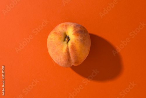 Peach on a bright orange backgound