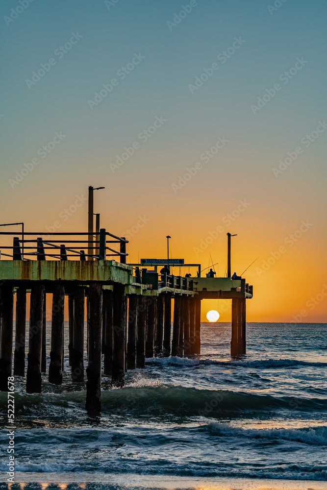 sunrise at sea by the pier