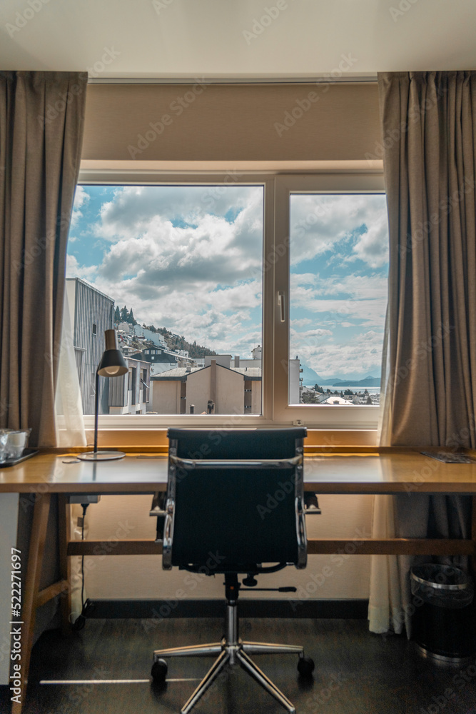 Fototapeta premium room with desk and table for working with mountain views