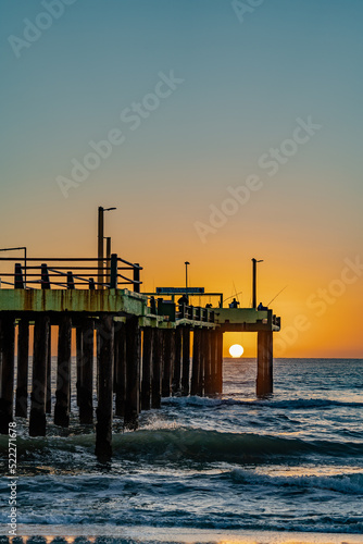 sunrise at sea by the pier