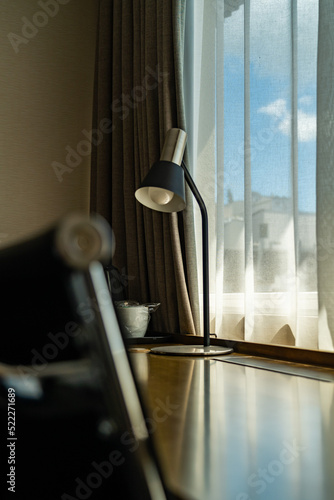 room with desk and table for working with mountain views