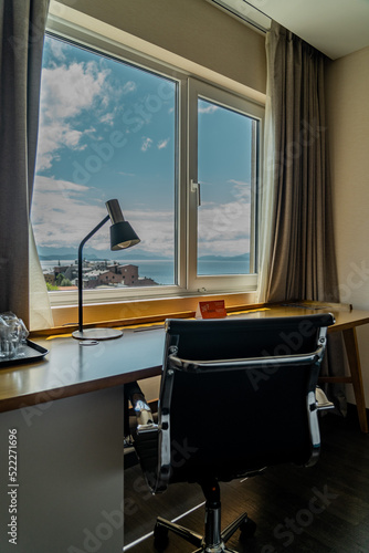 room with desk and table for working with mountain views