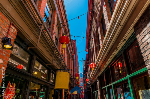 Vászonkép A view down a narrow shopping alleyway in Chinatown in Victoria British Colombia