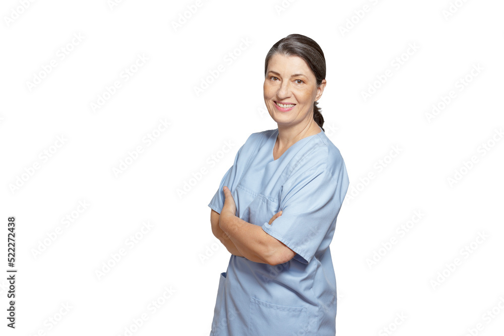 Friendly smiling mature nurse in a blue scrub, isolated on white background, copy or text space. Friendly smiling mature nurse in a blue scrub, isolated on white background, copy or text space.