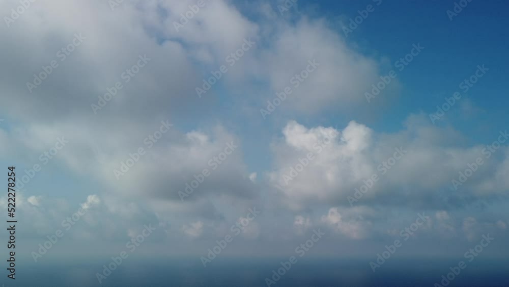 Abstract aerial nature summer ocean sunset sea and sky background. Small waves on clear water surface in motion blur with bokeh lights from sunrise. Holiday, vacation and recreational concept Abstract aerial nature summer ocean sunset sea and sky background. Small waves on clear water surface in motion blur with bokeh lights from sunrise. Holiday, vacation and recreational concept