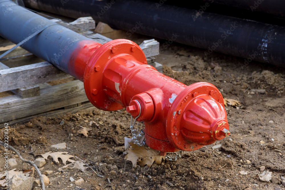 The fire hydrant is prepared for installation on the construction site to for emergency situation The fire hydrant is prepared for installation on the construction site to for emergency situation
