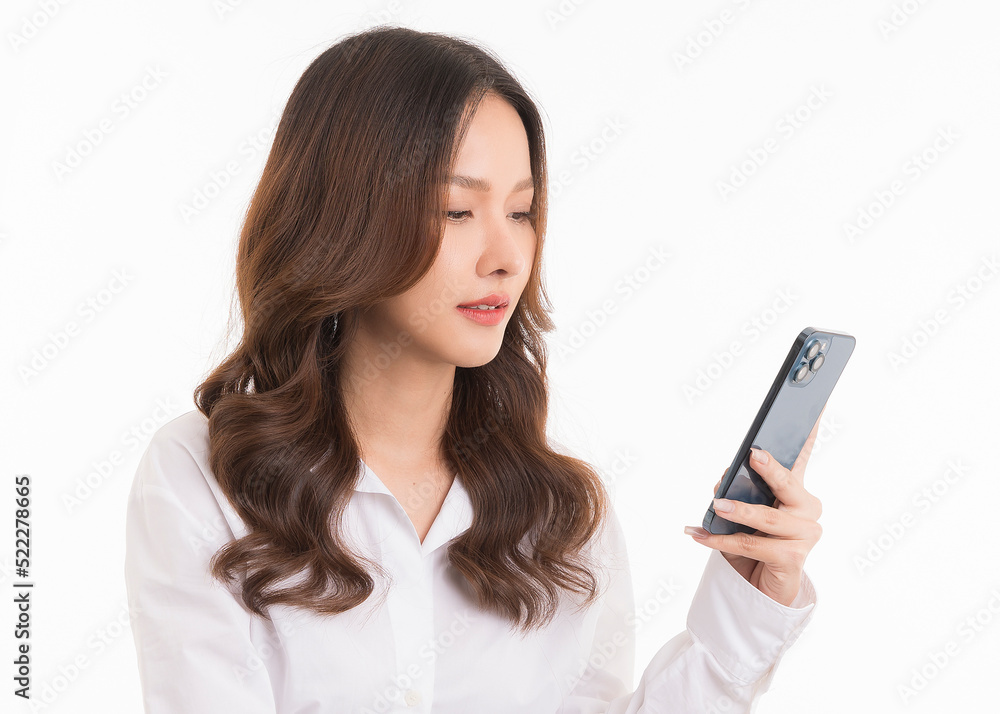 Portrait of asian woman holding a smartphone isolated on white background. Portrait of asian woman holding a smartphone isolated on white background.