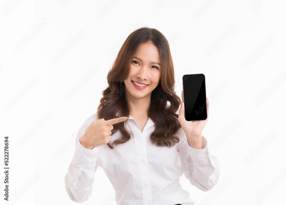 Asian woman with long hair wearing a white shirt holding black screen phone standing isolated on white background. Asian woman with long hair wearing a white shirt holding black screen phone standing isolated on white background.