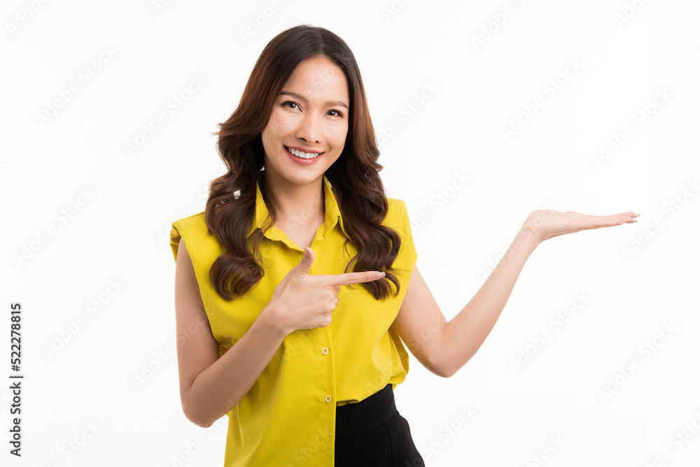 Shopping concept. Beautiful asian woman pointing fingers at upper right corner logo banner, smiling, standing isolated on white background. Shopping concept. Beautiful asian woman pointing fingers at upper right corner logo banner, smiling, standing isolated on white background.