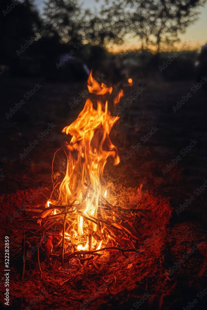 Campfire evening. The warmth of fire contrasting the cold wet horizon. Campfire evening. The warmth of fire contrasting the cold wet horizon.