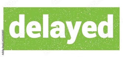 Photography delayed text written on green stamp sign.