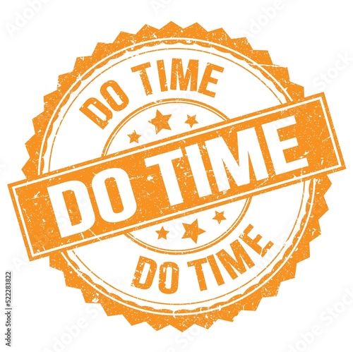DO TIME text on orange round stamp sign