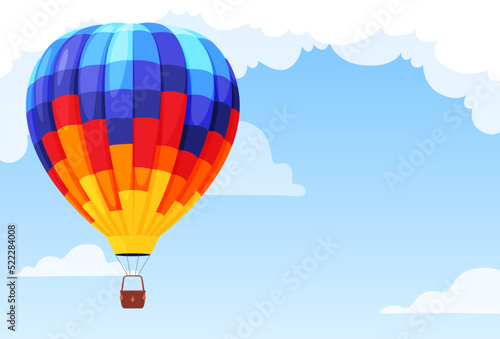 Colorful beautiful hot air balloon on the background of the sky with clouds. Vector illustration