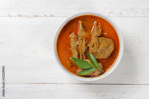 Foto Kari daging sapi or Gulai daging or Beef Curry with tender beef, braised in coconut milk and curry spices