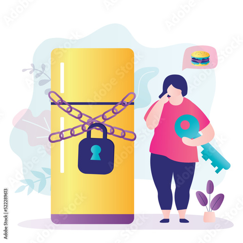 Fat girl stands near refrigerator covered with chains. Woman thinks to open fridge and eat or not to open