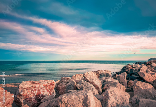 Natural background of the colorful sky at sunset and beautiful water reflection. Sea views. Sea landscape