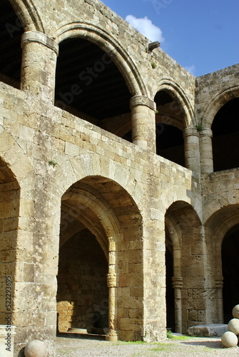 Arches in the wall around the courtyard in the Palace of the Grand Master of the Knights of Rhodes, on the island of Rhodes, Greece
