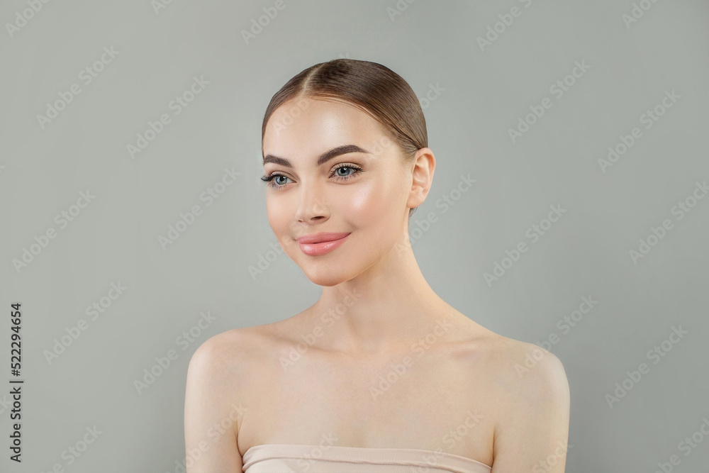 Portrait of cheerful healthy woman with clean skin. Facial treatment, skincare and spa concept Portrait of cheerful healthy woman with clean skin. Facial treatment, skincare and spa concept