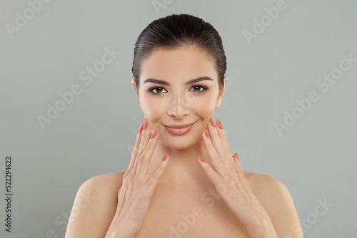 Happy model woman holding perfect hands with manicure on white background